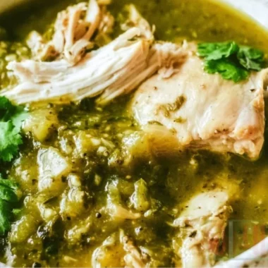 Healthy Anti-Inflammatory Chicken Green Chile dish garnished with fresh herbs.