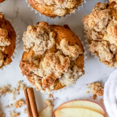Freshly baked apple crumble muffins with a crispy crumble topping