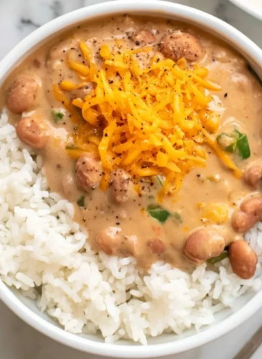 A bowl of easy homemade pinto beans with spices and herbs.