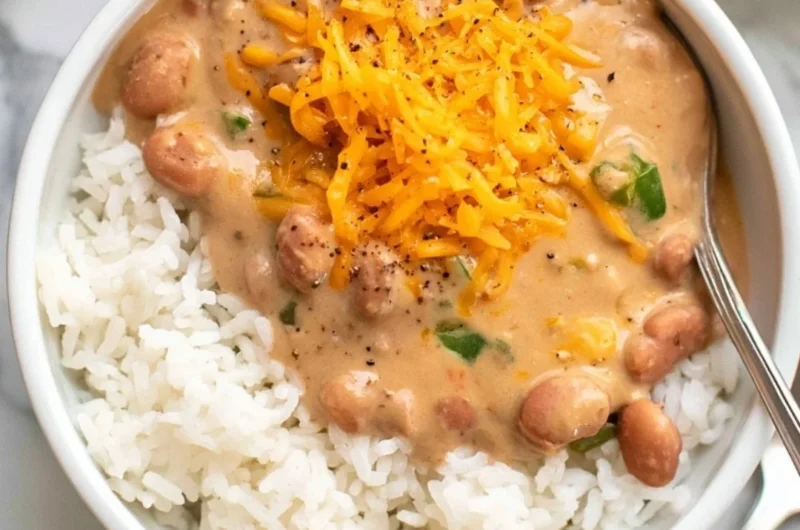 A bowl of easy homemade pinto beans with spices and herbs.