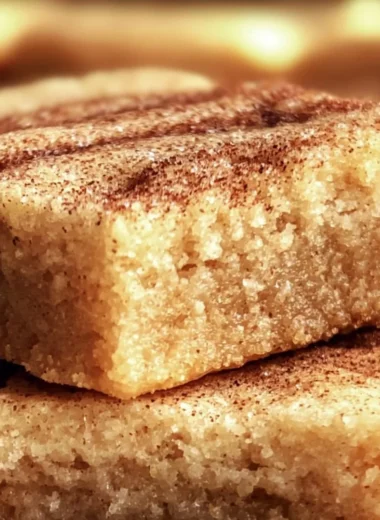 Delicious chewy snickerdoodle cookie bars with a sweet cinnamon topping