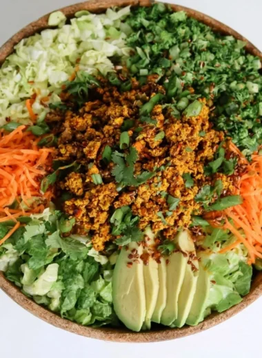 Delicious egg roll salad in a bowl with colorful vegetables and sesame dressing