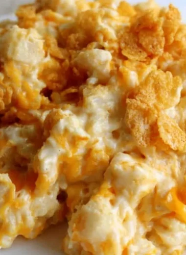 Delicious platter of funeral potatoes, a creamy potato casserole dish.
