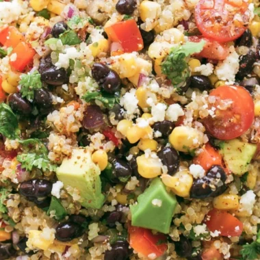 A vibrant quinoa black bean salad with colorful vegetables and healthy ingredients.