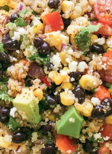 A vibrant quinoa black bean salad with colorful vegetables and healthy ingredients.